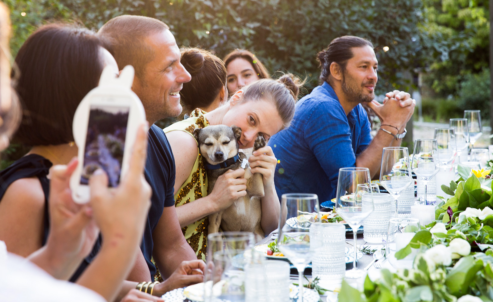 Elettra Rossellini Wiedemann  photographed entertaining at an outdoor table with friends in the Hamptons.